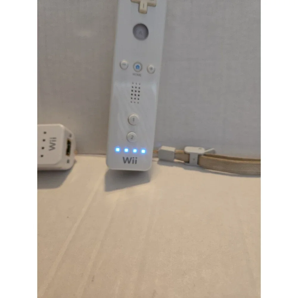 Pair Of Nintendo Wii Remotes With Nunchucks
